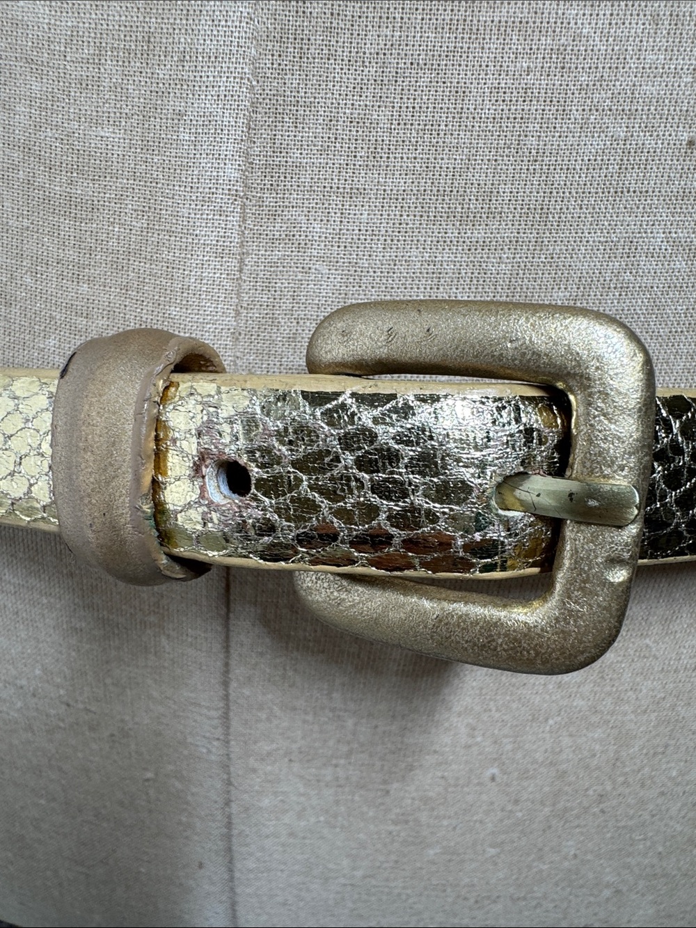 Unbranded gold croc embossed women’s belt.
